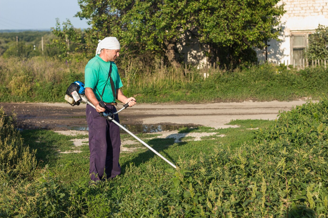man-farm-sewing-grass-with-lawn-mower_23-2148291051